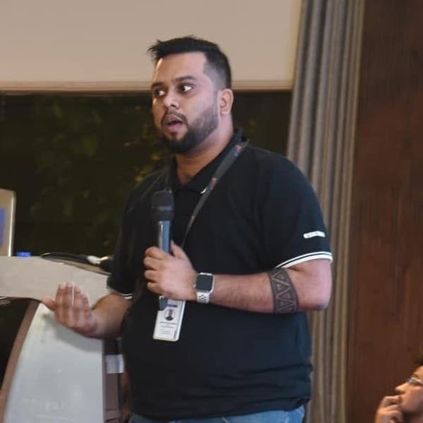 Joshua Prottoy Adhikari presenting at an industry event