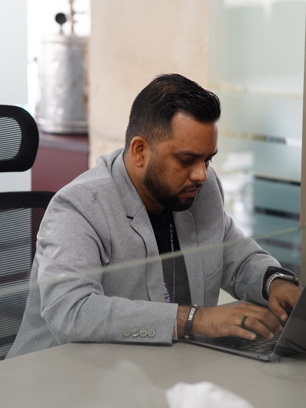 Joshua Prottoy Adhikari working at his desk