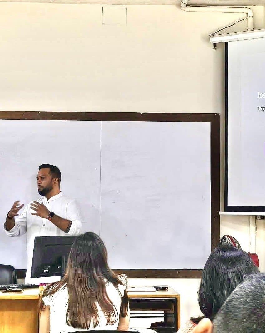 Joshua Prottoy Adhikari teaching a marketing workshop